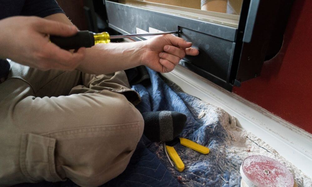 NFI-certified fireplace technician providing professional repair service